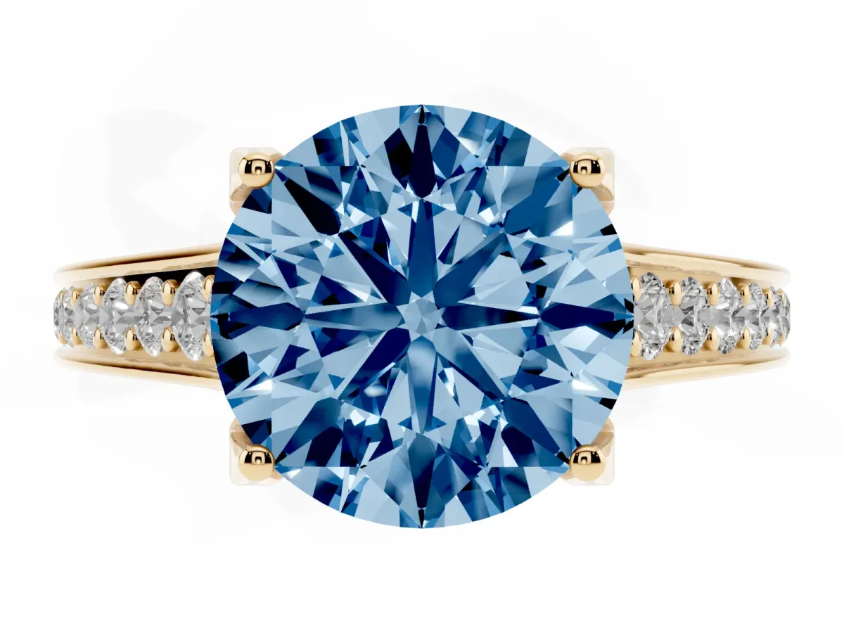Fancy Blue Round Cut Brilliant Cut Diamond Engagement Ring with Pavé Band and Four-Prong Setting Yellow gold