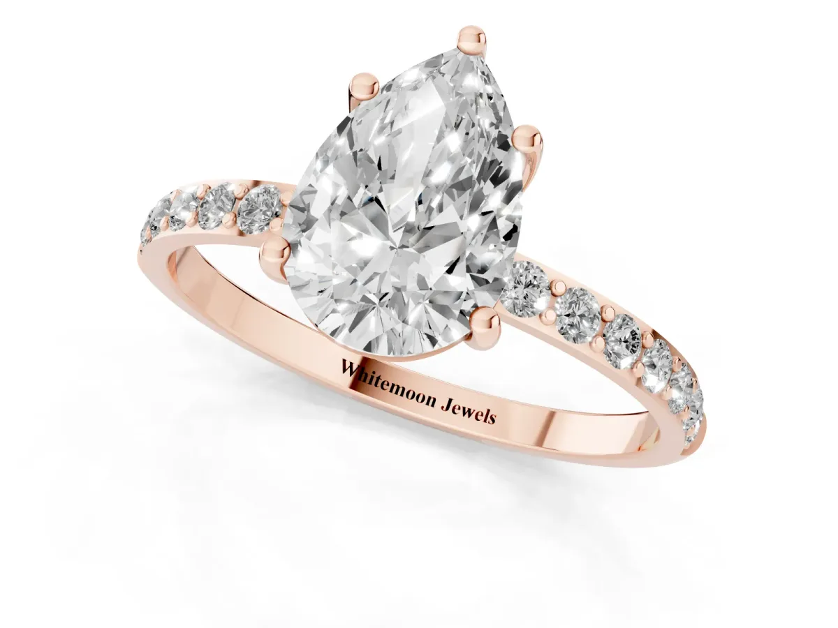 Pear Cut Diamond Solitaire Ring with Round Pavé Shoulders and Prong Setting Rose gold