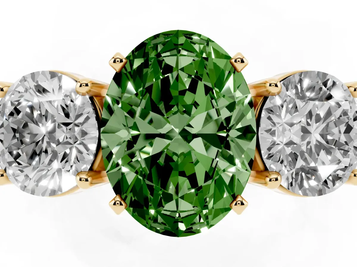 Fancy Green Three-Stone Oval Cut Diamond Ring with Round Side Stones, Classic Band, and Four-Prong Setting Yellow gold