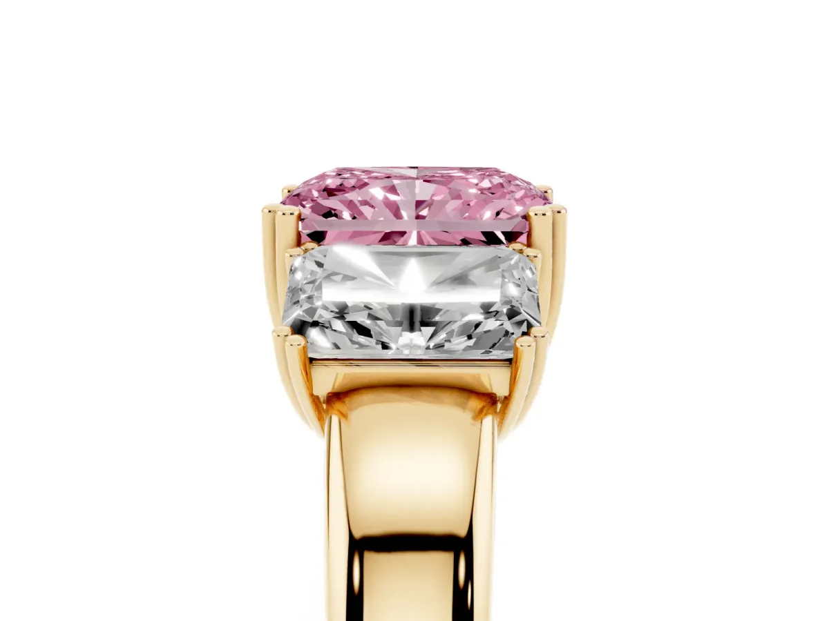 Fancy Pink Three-Stone Radiant Cut Cut Diamond Ring with Channel Set Band and Four-Prong Setting Yellow gold
