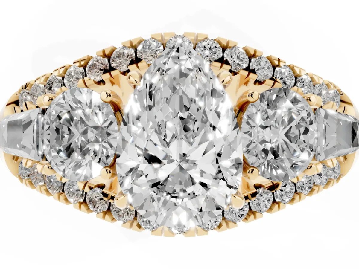Three-Stone Pear Cut Diamond Engagement Ring with Pave Band and Prong Setting Yellow gold