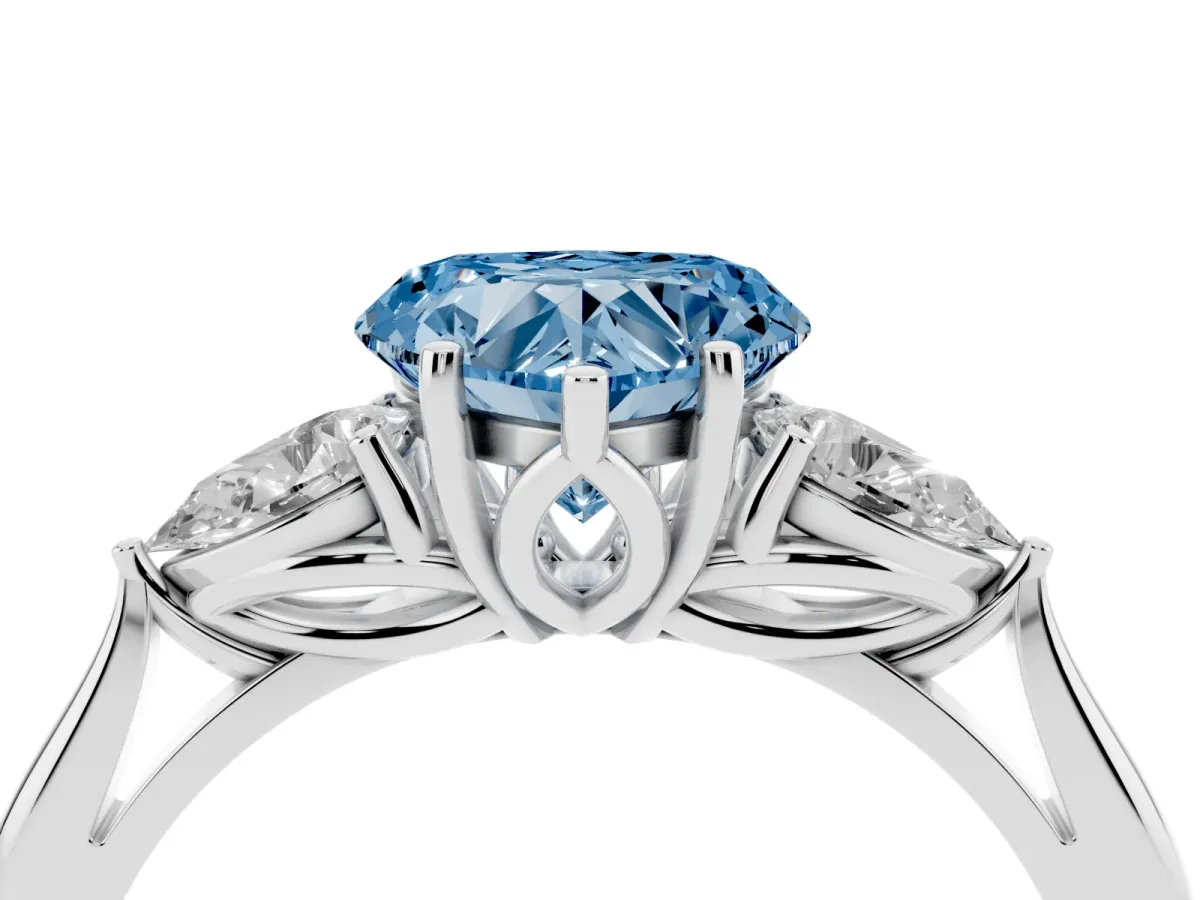 Fancy Blue Three-Stone Heart Cut Diamond Ring with Pear Side Stones in Four-Prong Setting Silver
