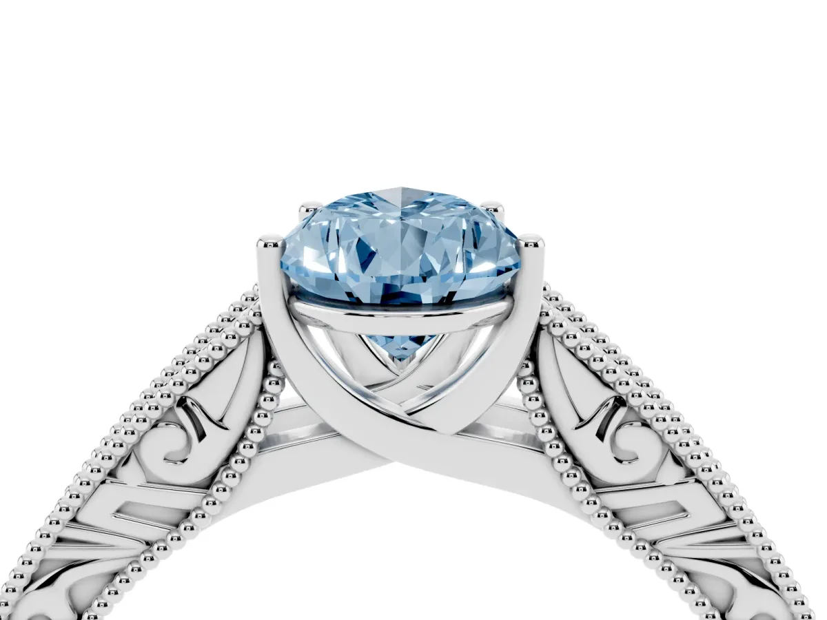 Fancy Blue Pear Cut Diamond Solitaire Ring with Engraved Band and Four-Prong Setting White gold