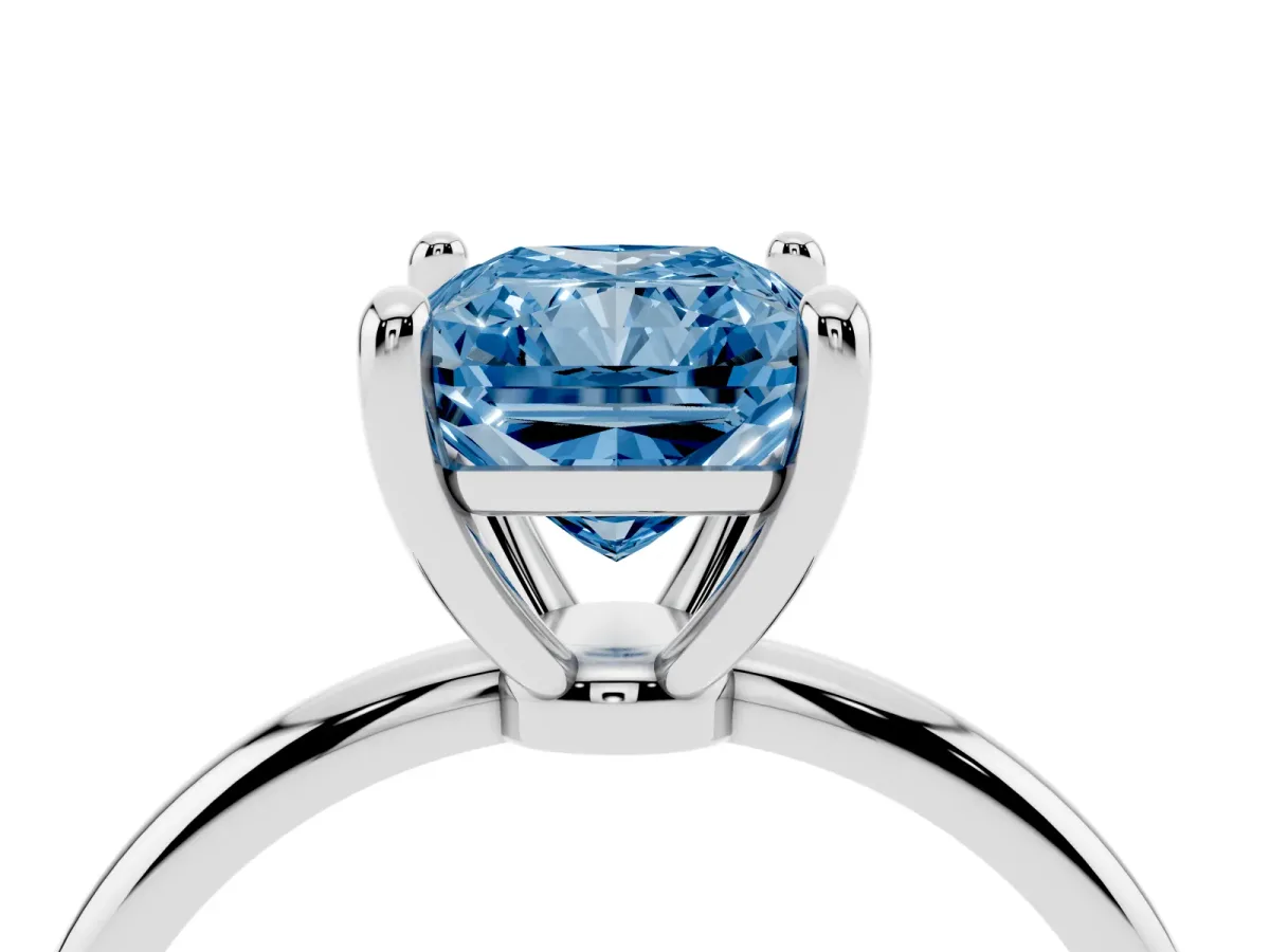 Fancy Blue Radiant Cut Solitaire Diamond Ring with 4-Prong Setting on a Classic Band Silver
