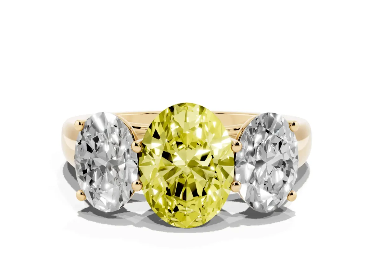 Fancy Yellow Oval Cut Three-Stone Diamond Ring with Prong Setting on a Classic Band Yellow gold