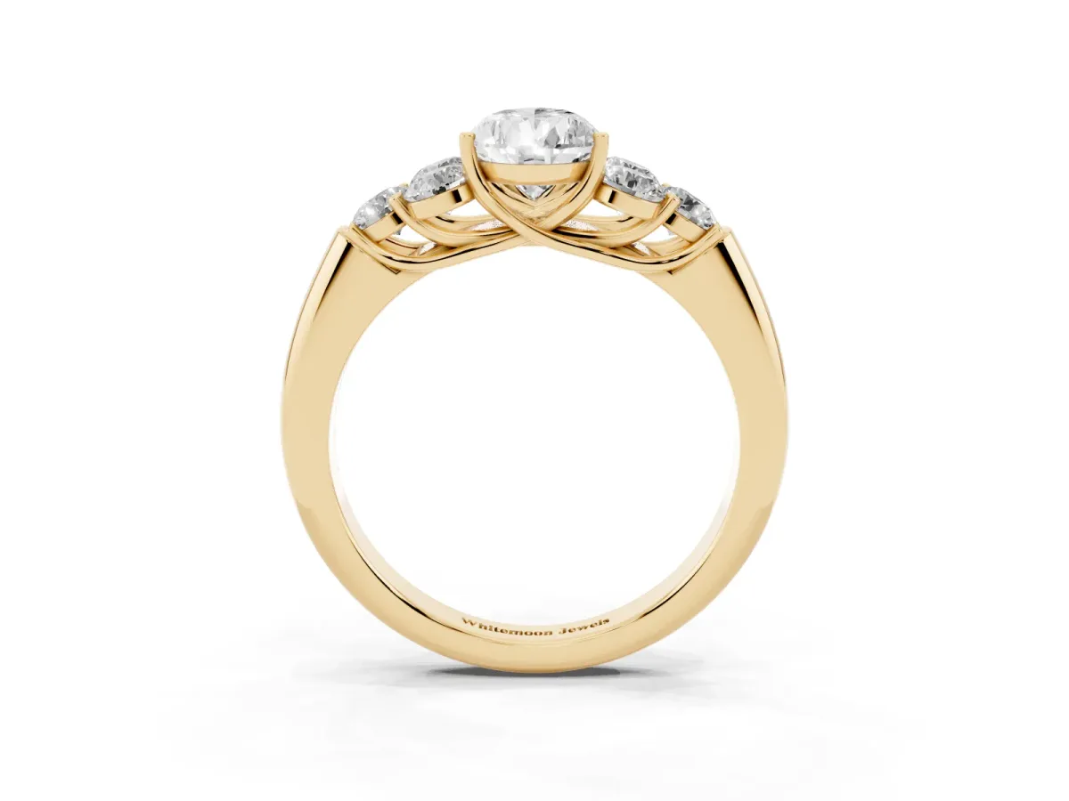 Pear Cut Cut Diamond Cluster Ring with Round Accent Stones and Prong Setting on a Classic Band Yellow gold