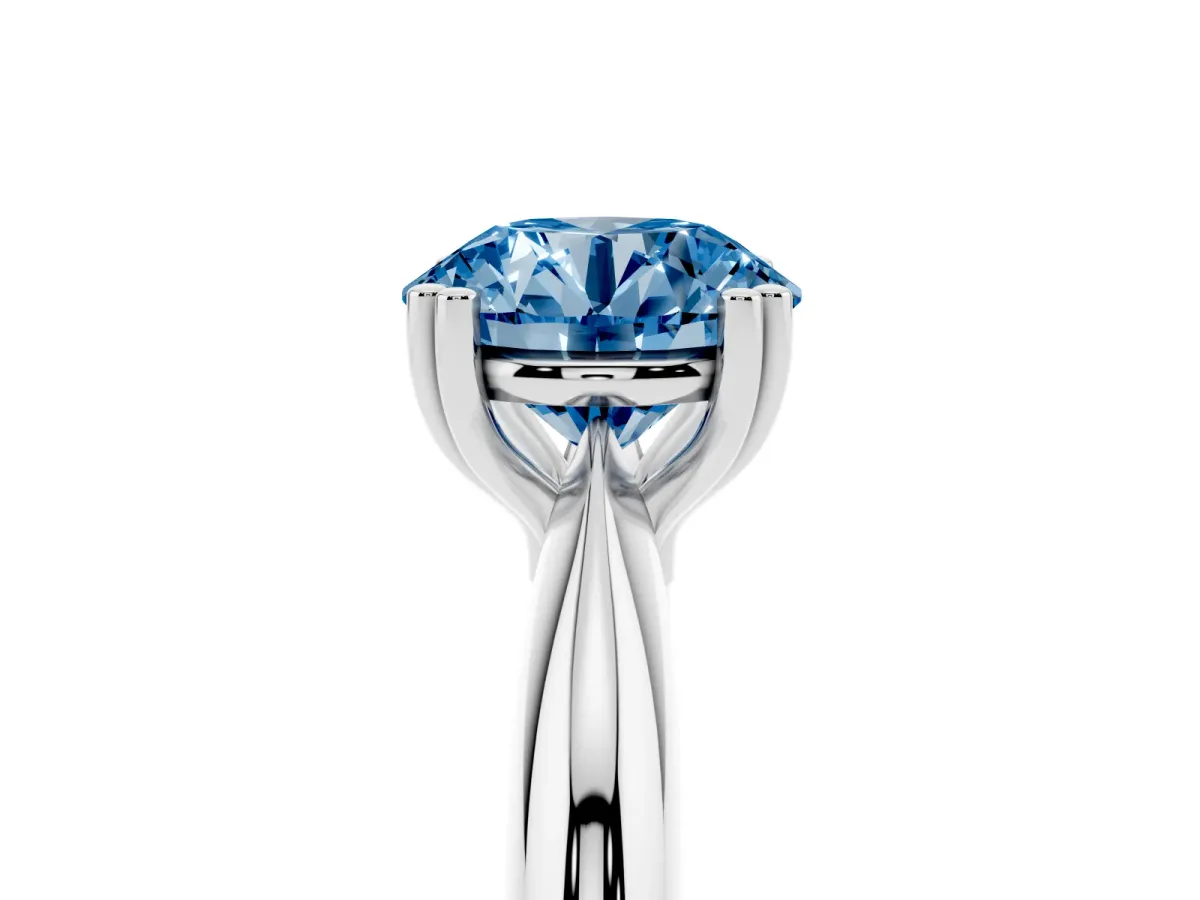 Fancy Blue Round Cut Cut Solitaire Engagement Ring with Tapered Band and Four-Prong Setting Silver