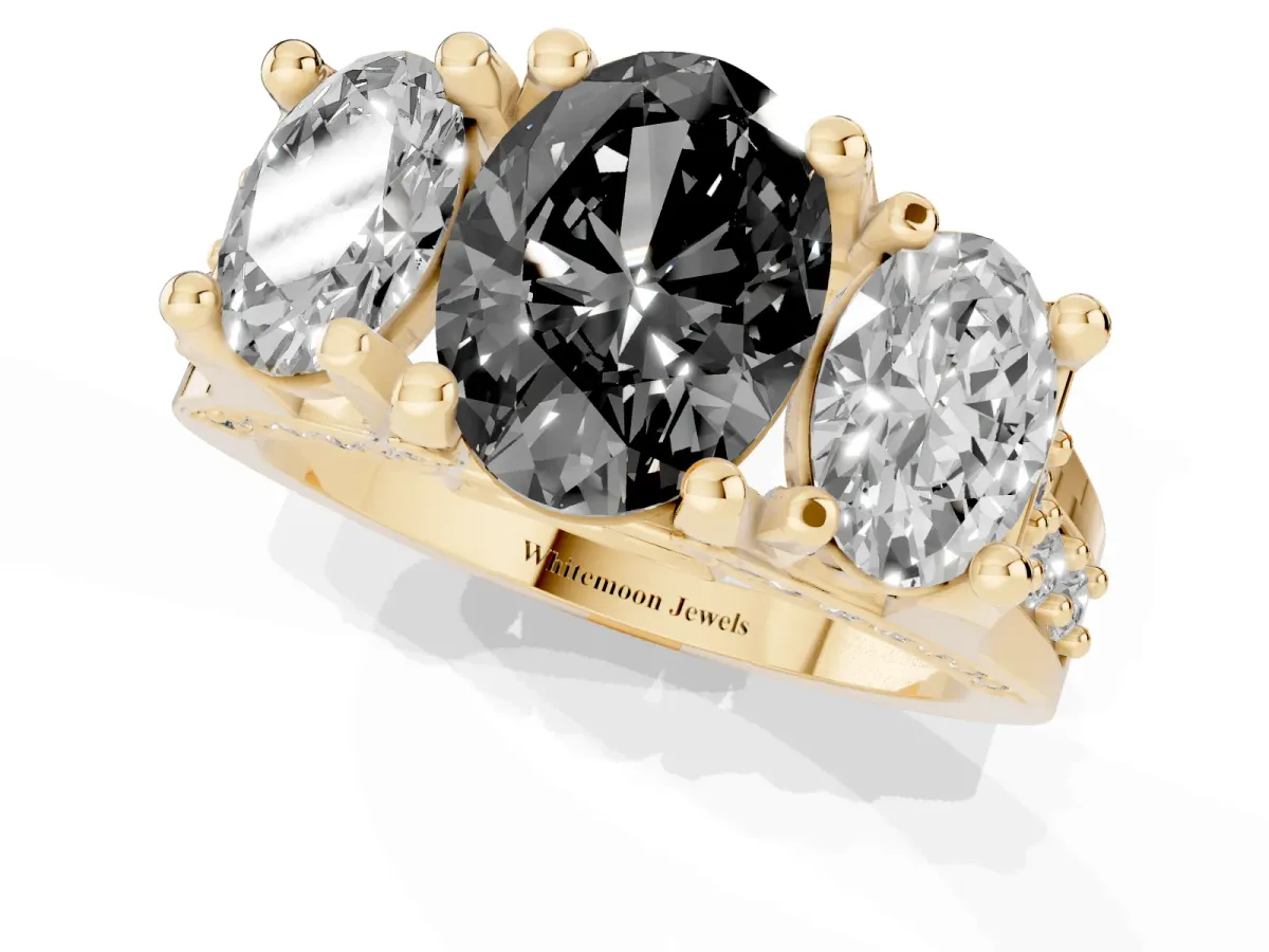 Fancy Black Oval Cut Diamond Three-Stone Ring with Channel Set Band and Four-Prong Setting Yellow gold