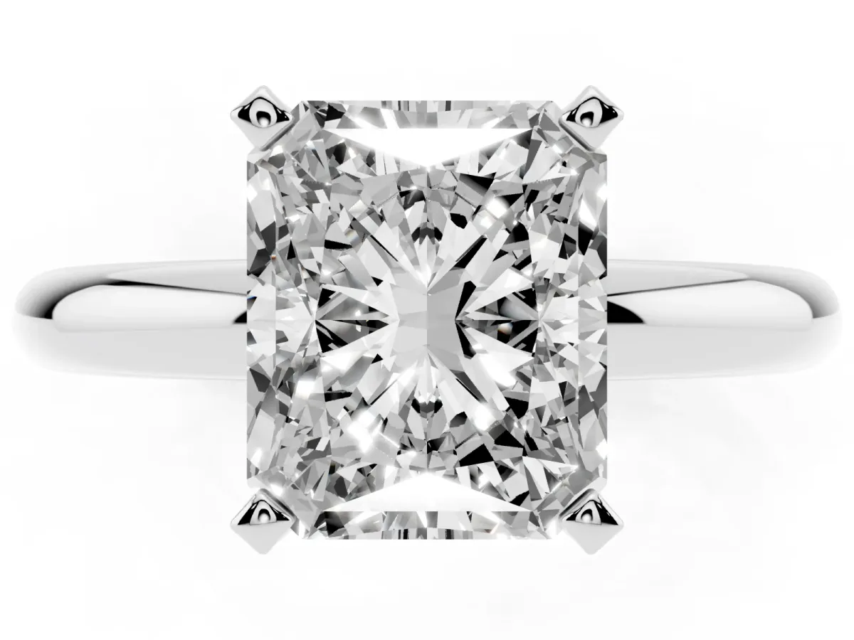Radiant Cut Diamond Solitaire Engagement Ring with Round Band and Four-Prong Setting Silver