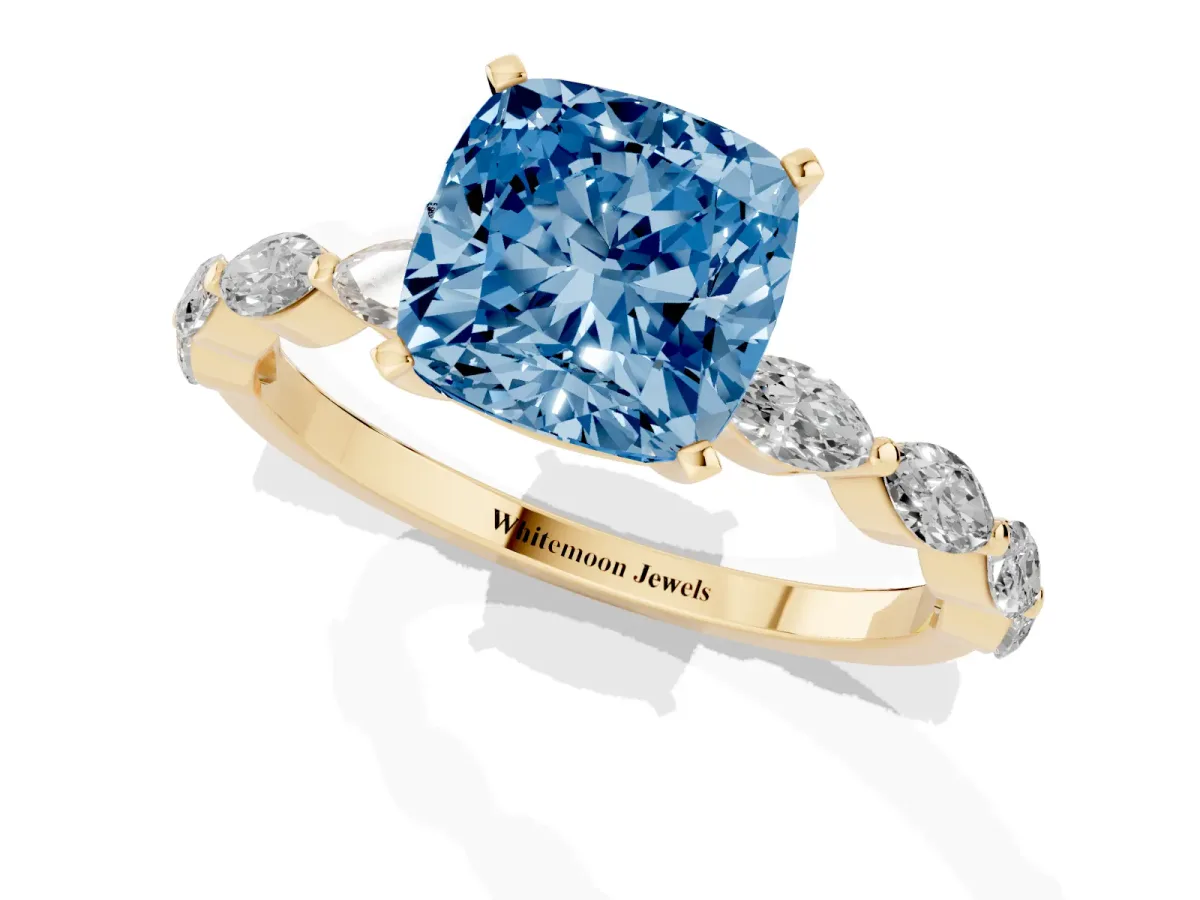 Fancy Blue Cushion Cut Diamond Ring with Marquise Side Stones and Prong Setting Yellow gold