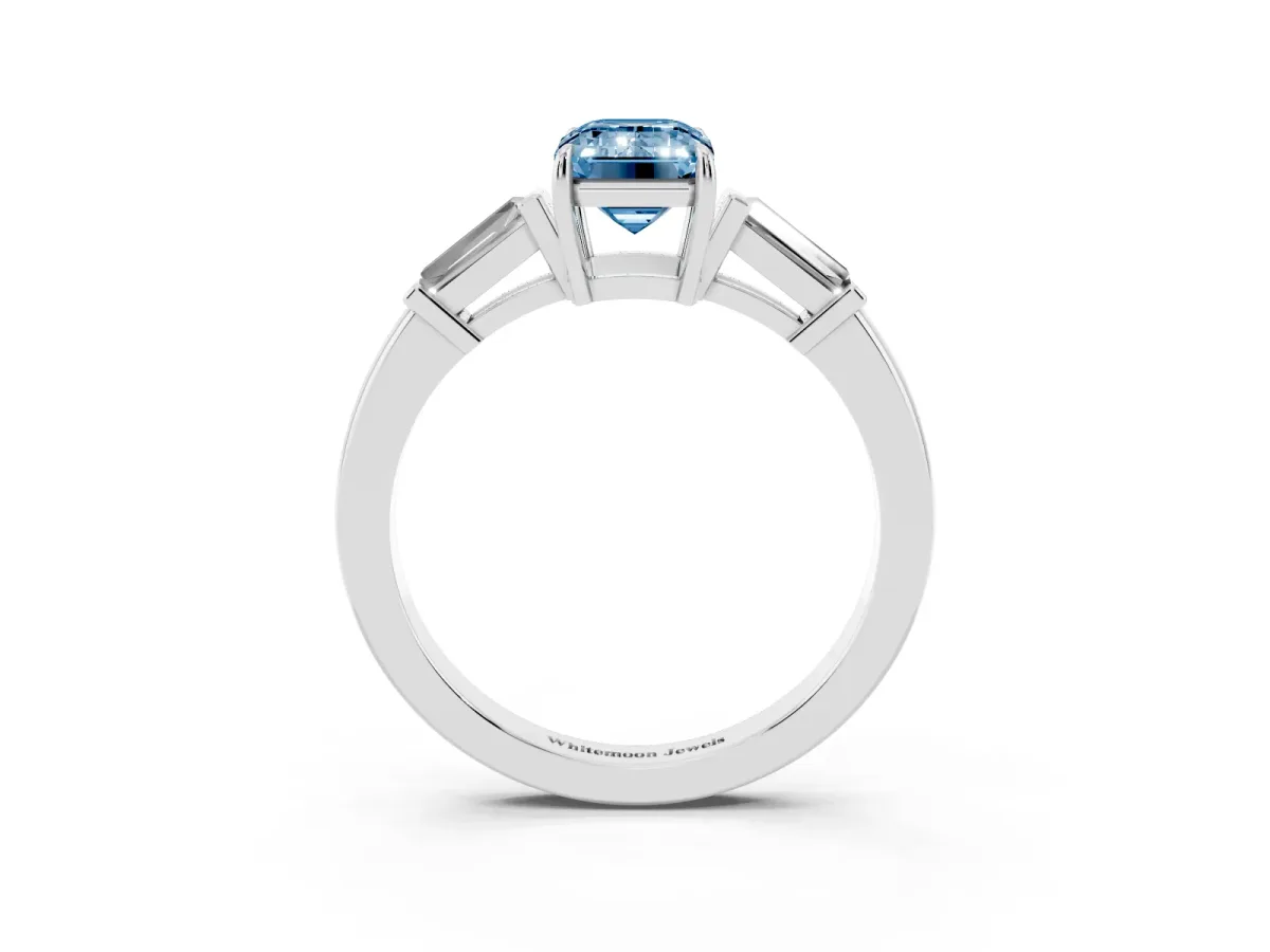 Fancy Blue Emerald Cut Diamond Three-Stone Ring with Tapered Baguette Side Stones and Prong Setting Platinum
