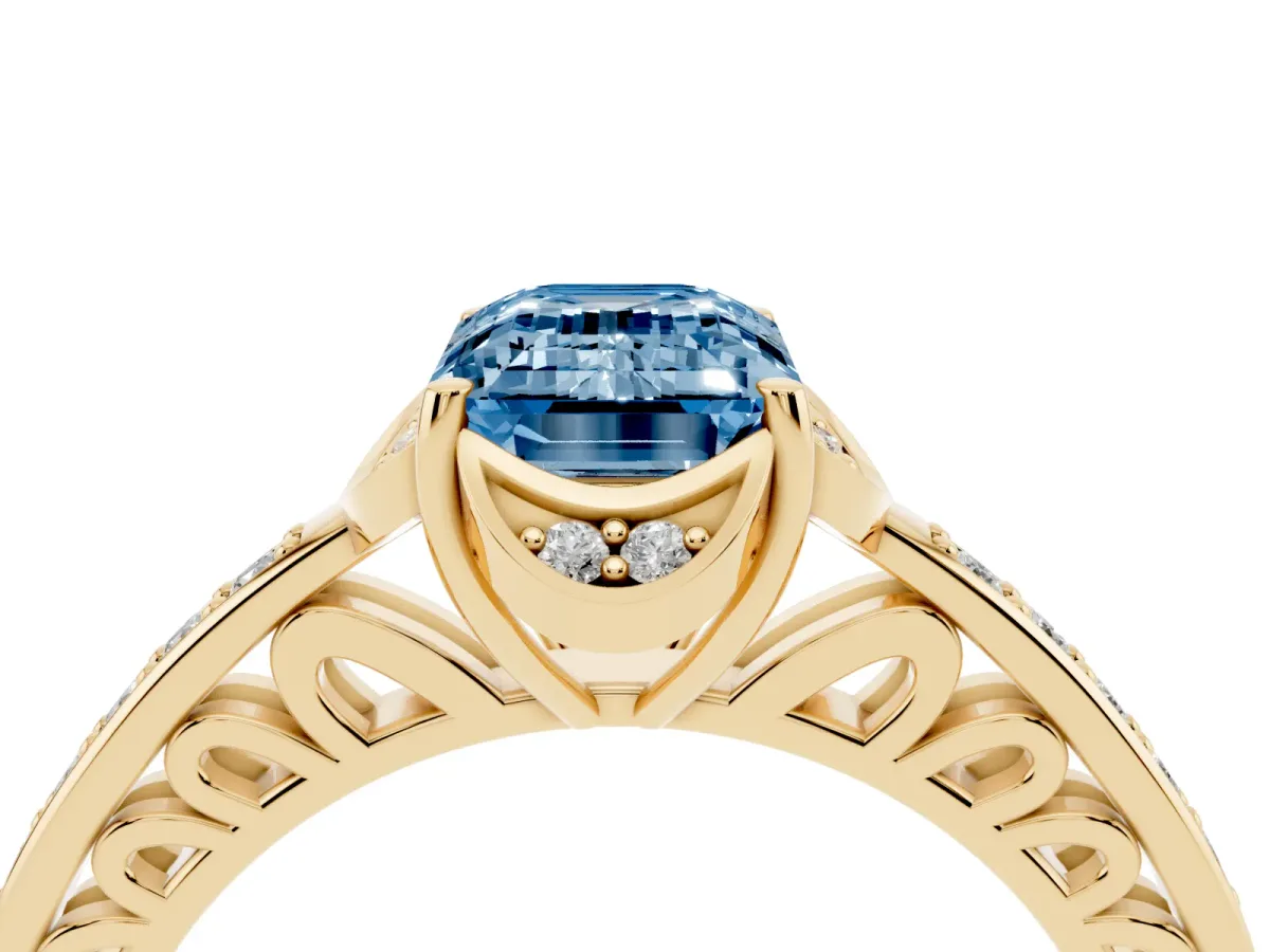 Fancy Blue Emerald Cut Cut Halo Diamond Ring with Channel Set Band and Four-Prong Setting Yellow gold