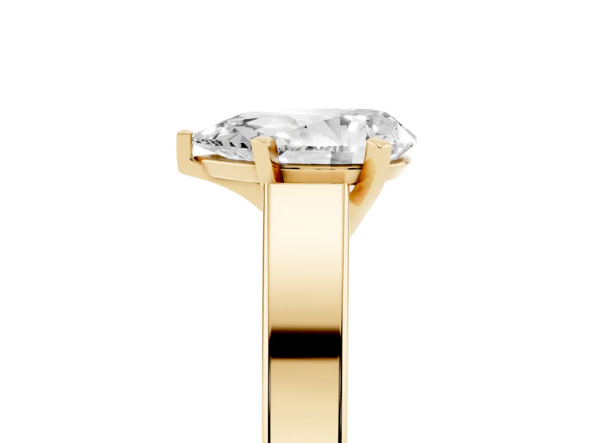 Pear Cut Solitaire Engagement Ring with Four-Prong Setting and Tapered Band Yellow gold