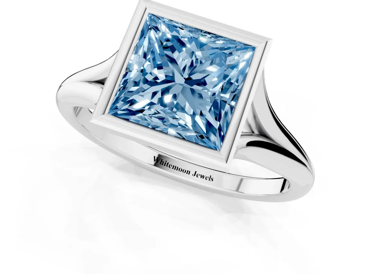 Fancy Blue Bezel Set Princess Cut Cut Solitaire Ring with Tapered Band Silver