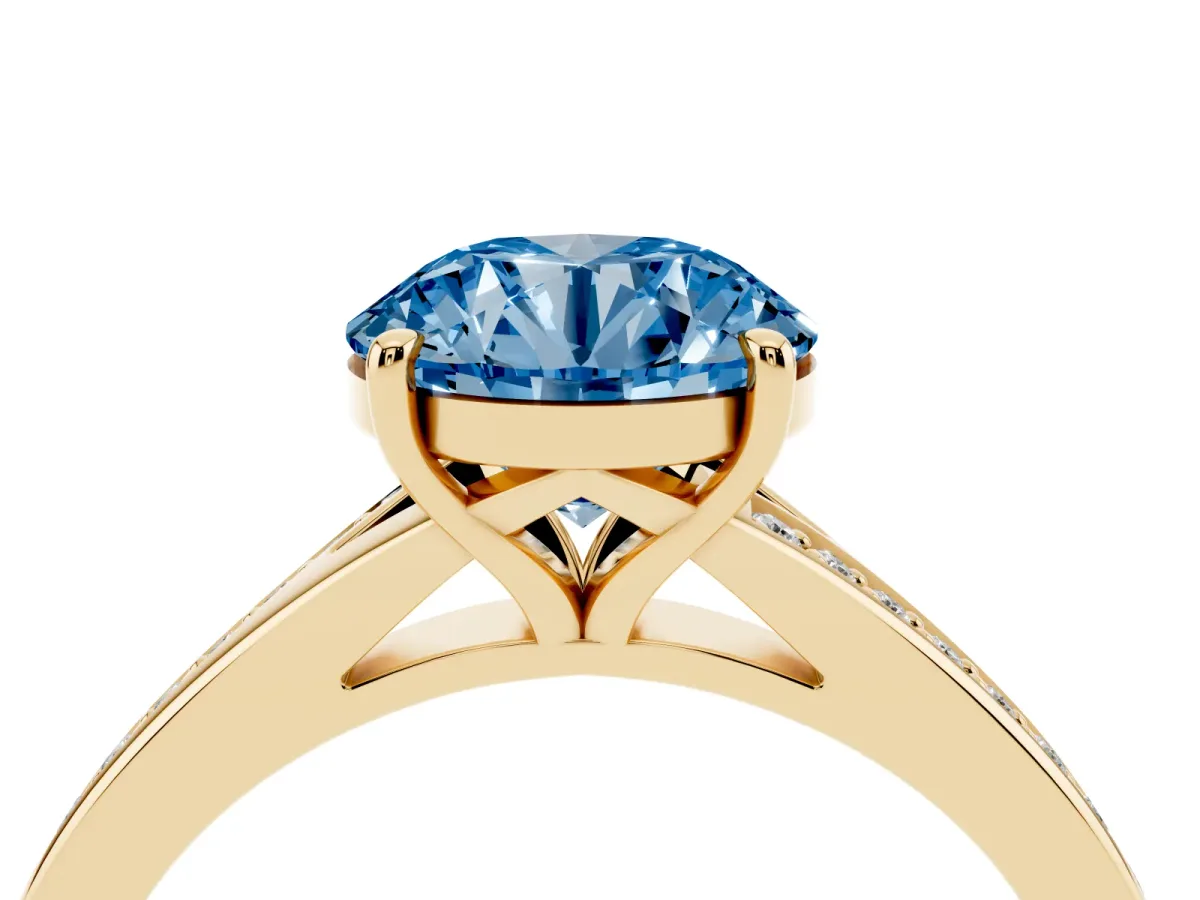 Fancy Blue Round Cut Diamond Solitaire Ring with Pavé Band and Prong Setting Yellow gold