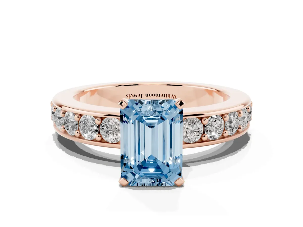 Fancy Blue Emerald Cut Diamond Engagement Ring with Channel Set Round Band and Prong Setting Rose gold