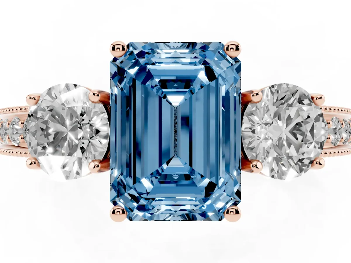 Fancy Blue Emerald Cut Three-Stone Diamond Ring with Pavé Band and Four-Prong Setting Rose gold