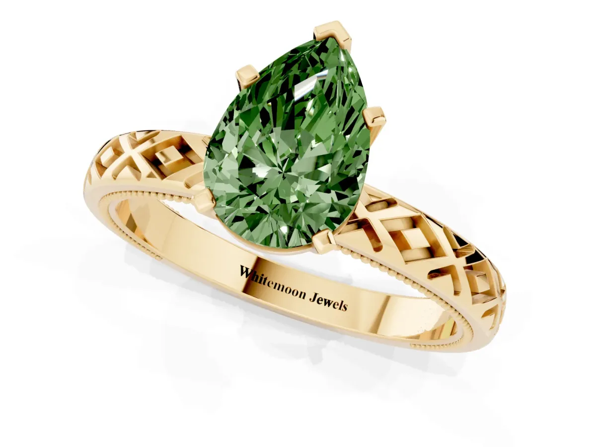 Fancy Green Pear Cut Solitaire Diamond Ring with Milgrain and Black Enamel X Pattern Band Yellow gold