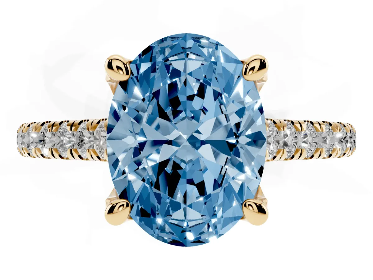 Fancy Blue Oval Cut Brilliant Diamond Solitaire with Pavé Band and Four-Prong Setting Yellow gold