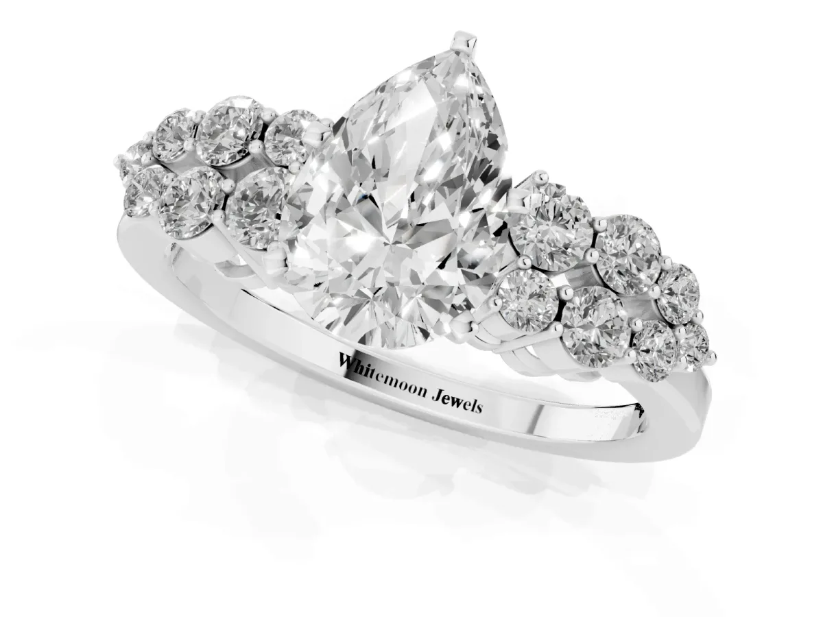 Pear Cut Cluster Diamond Engagement Ring with Pavé Band and Four-Prong Setting Silver