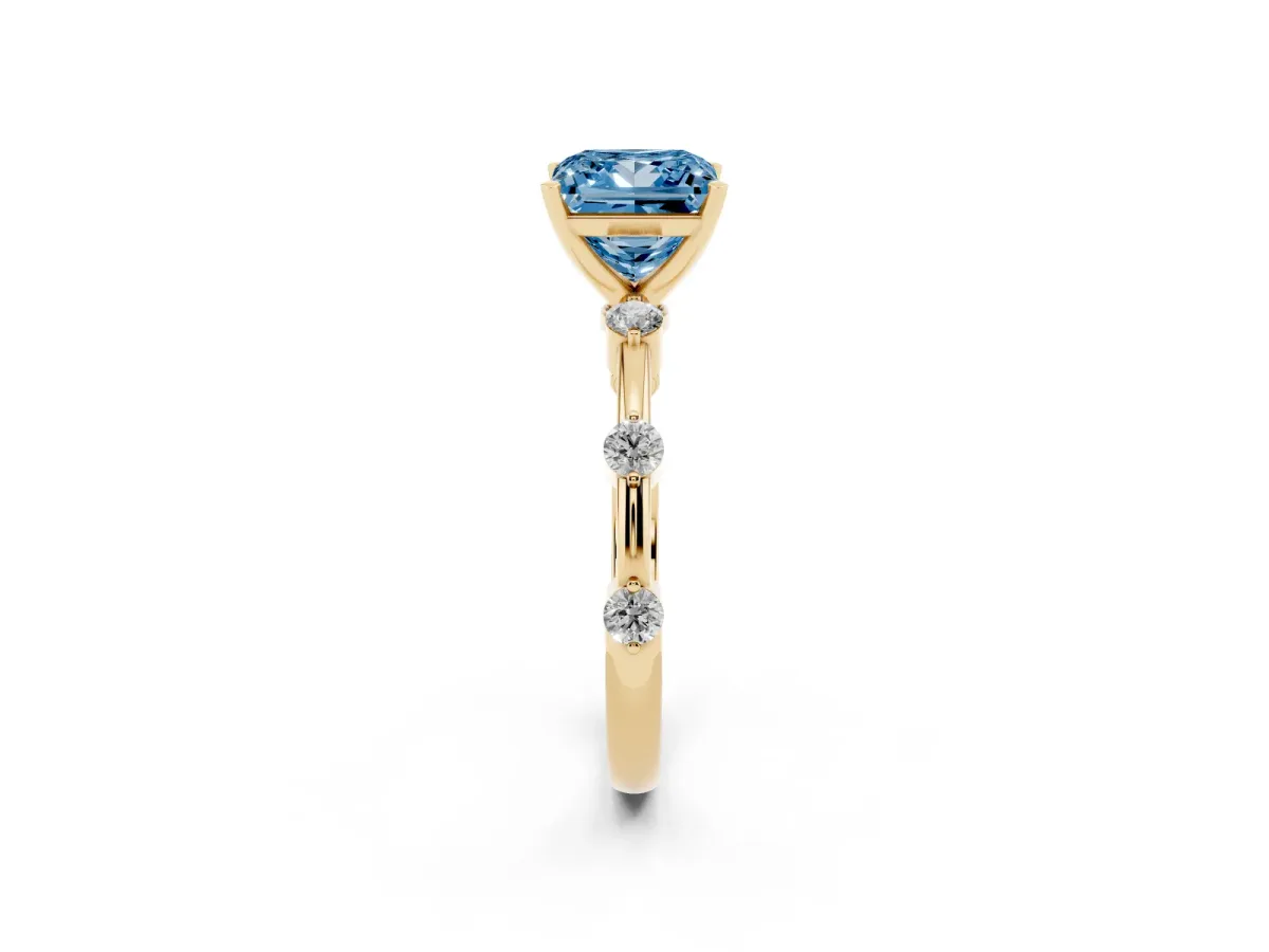 Fancy Blue Princess Cut Solitaire Diamond Ring with Bezel Set Side Stones and Prong Setting Yellow gold