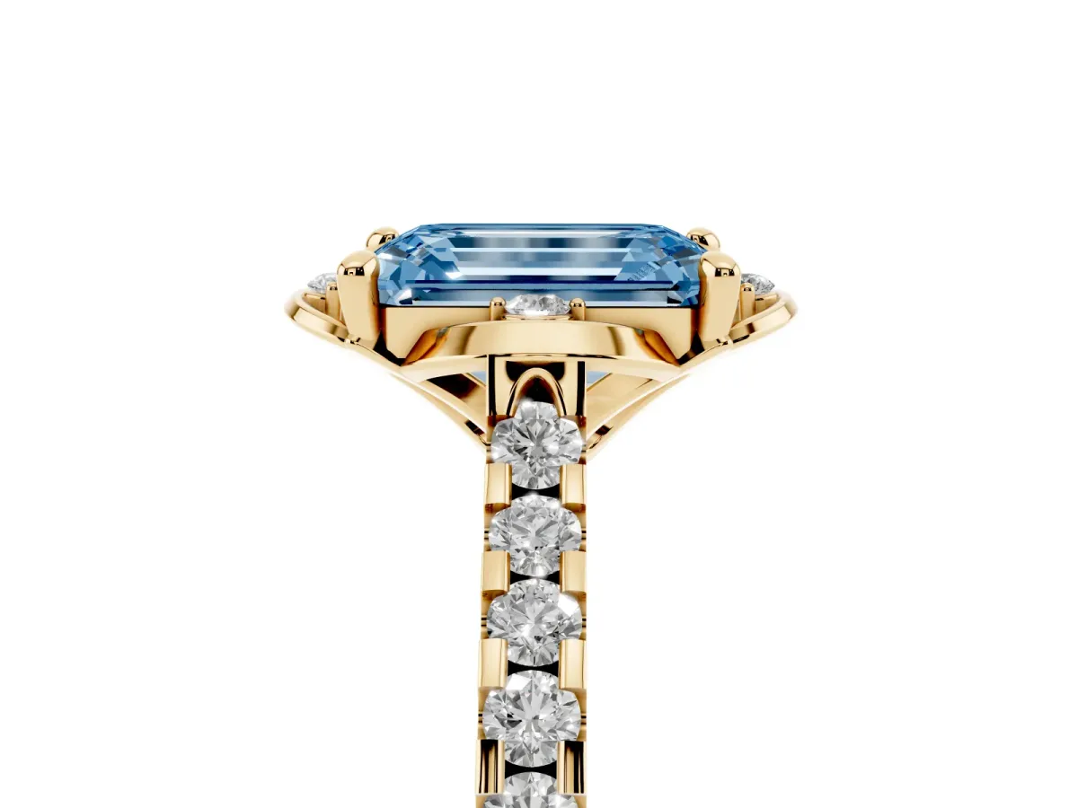 Fancy Blue Emerald Cut Diamond Ring with Pavé Band and Floral Prong Setting Yellow gold