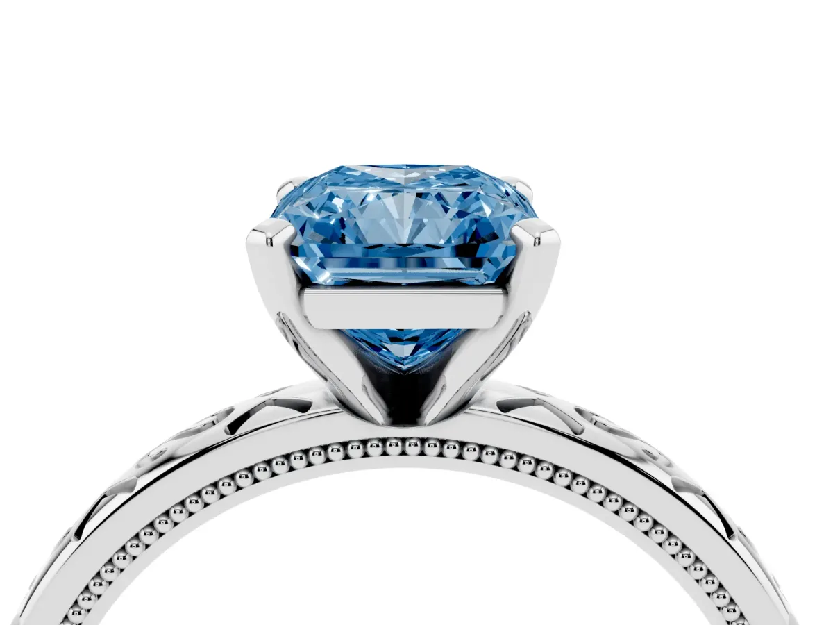 Fancy Blue Radiant Cut Solitaire Engagement Ring with Scrollwork Band and Four-Prong Setting Silver