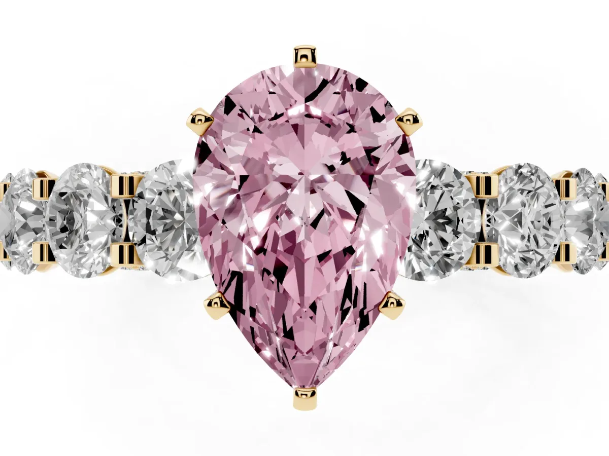 Fancy Pink Pear Cut Diamond Side Stone Engagement Ring with Four-Prong Setting Yellow gold
