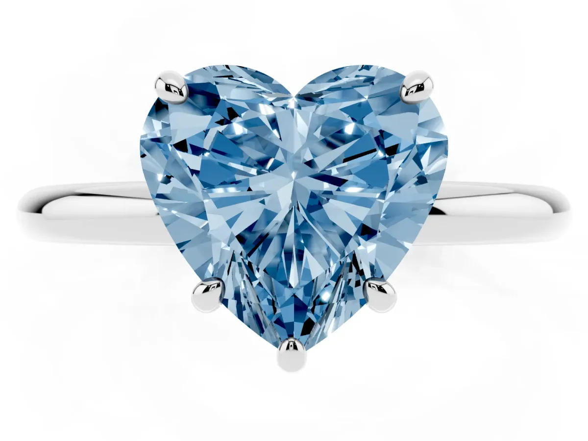 Fancy Blue Heart Cut Solitaire Diamond Ring with Four-Prong Setting on a Plain Band Platinum