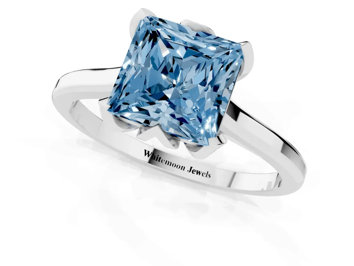 Fancy Blue Princess Cut Diamond Solitaire Ring with Flower Prong Setting and Classic Band Silver