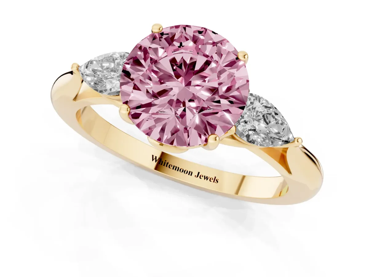 Fancy Pink Round Cut Diamond Three-Stone Ring with Pear Side Stones and Prong Setting Yellow gold