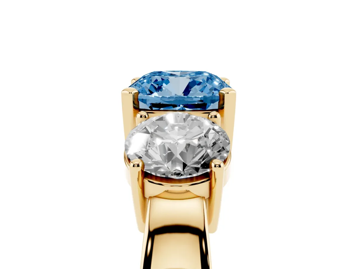 Fancy Blue Three-Stone Cushion Cut Diamond Ring with Round Side Stones, Classic Band, and Four-Prong Setting Yellow gold