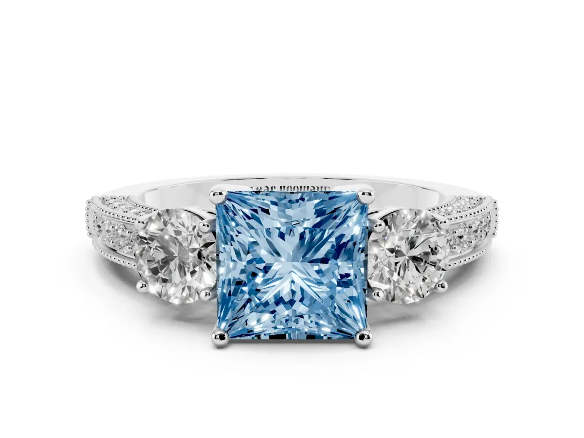 Fancy Blue Princess Cut Three-Stone Diamond Ring with Pavé Band and Four-Prong Setting Silver