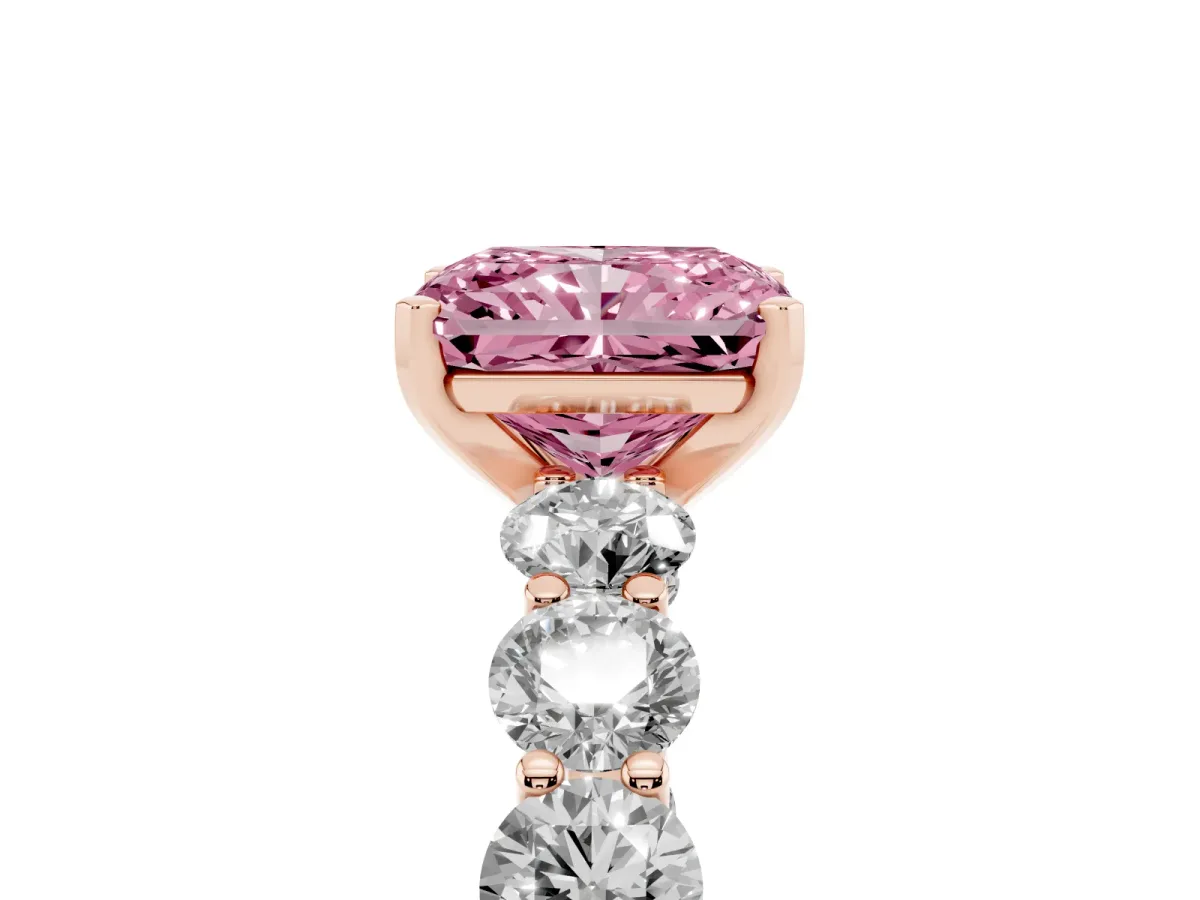 Fancy Pink Radiant Cut Diamond Prong Setting with Side Stones on a Pave Band Rose gold