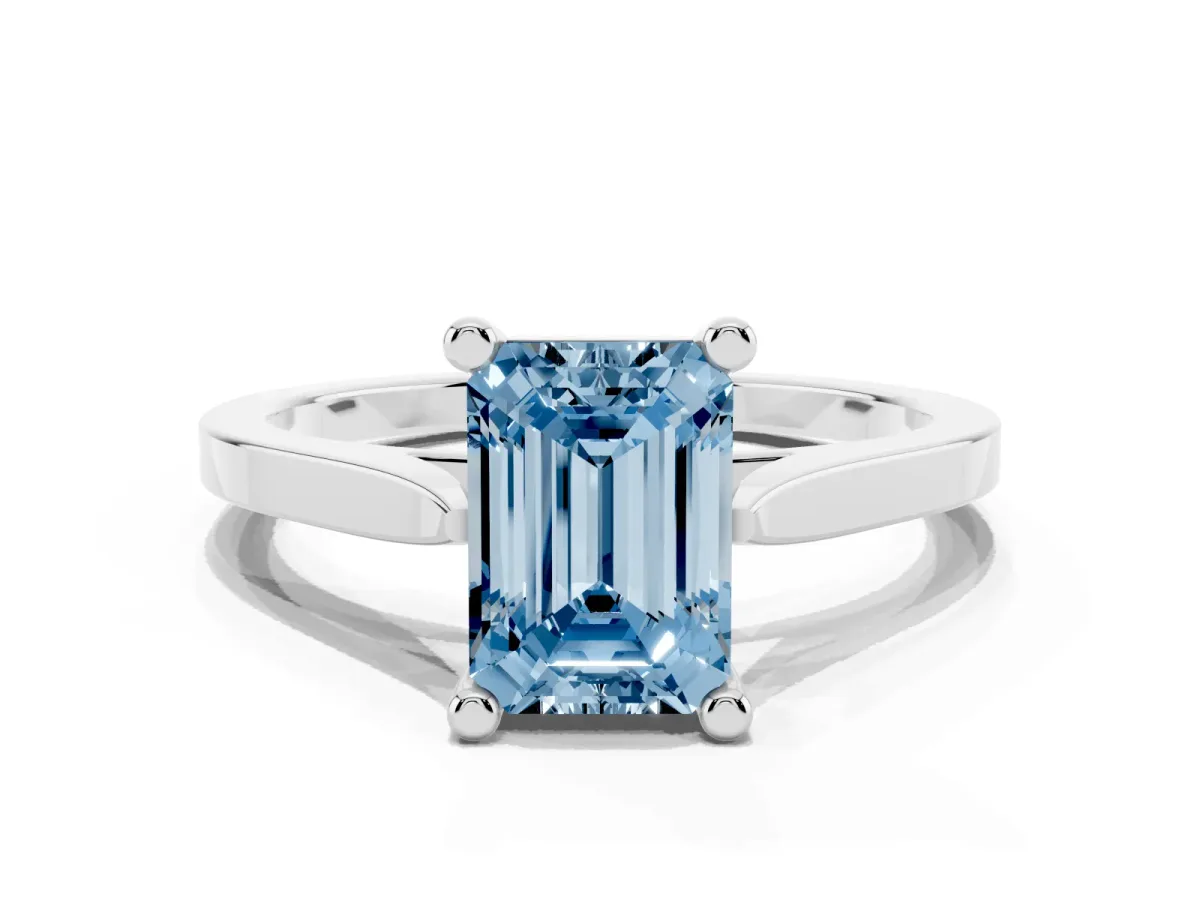 Fancy Blue Emerald Cut Solitaire Diamond Ring with Four-Prong Setting and Tapered Band Silver