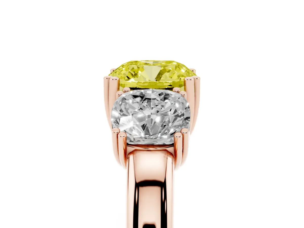 Fancy Yellow Three-Stone Cushion Cut Cut Diamond Ring with Channel Set Band and Four-Prong Setting Rose gold