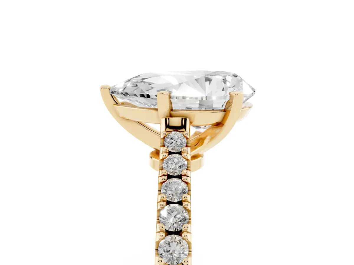 Pear Cut Cut Solitaire Diamond Engagement Ring with Pave Band and Four-Prong Setting Yellow gold