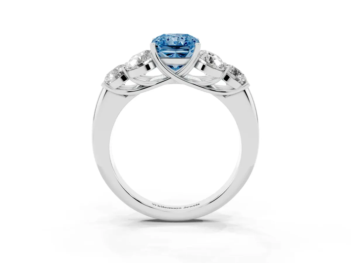 Fancy Blue Radiant Cut Cut Diamond Cluster Ring with Round Accent Stones and Prong Setting on a Classic Band White gold