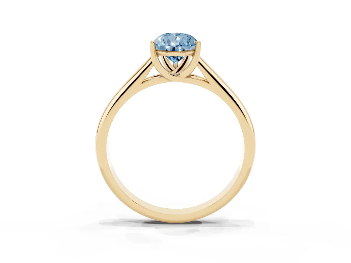 Fancy Blue Pear Cut Solitaire Engagement Ring with Tapered Band and Four-Prong Setting Yellow gold