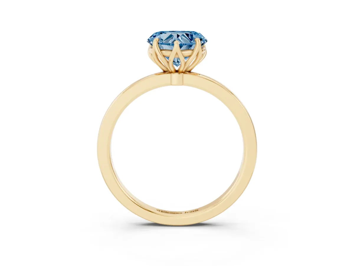Fancy Blue Heart Cut Diamond Solitaire Ring with Thin Band and Prong Setting Yellow gold