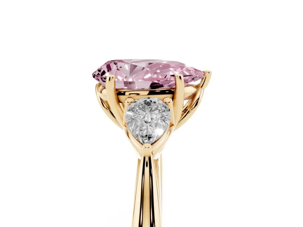 Fancy Pink Three-Stone Pear Cut Diamond Ring with Pear Side Stones in Four-Prong Setting Yellow gold