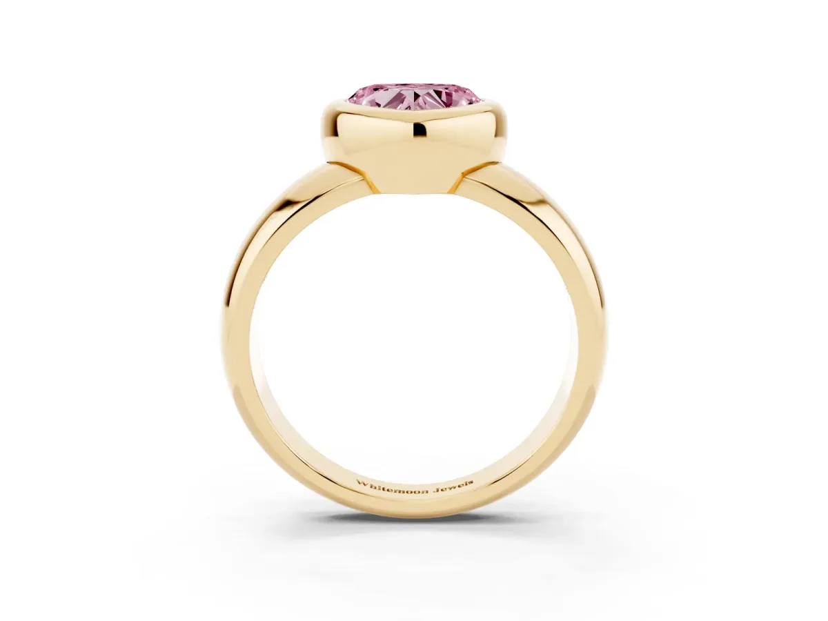 Fancy Pink Bezel Set Heart Cut Solitaire Ring with Wide Band Yellow gold