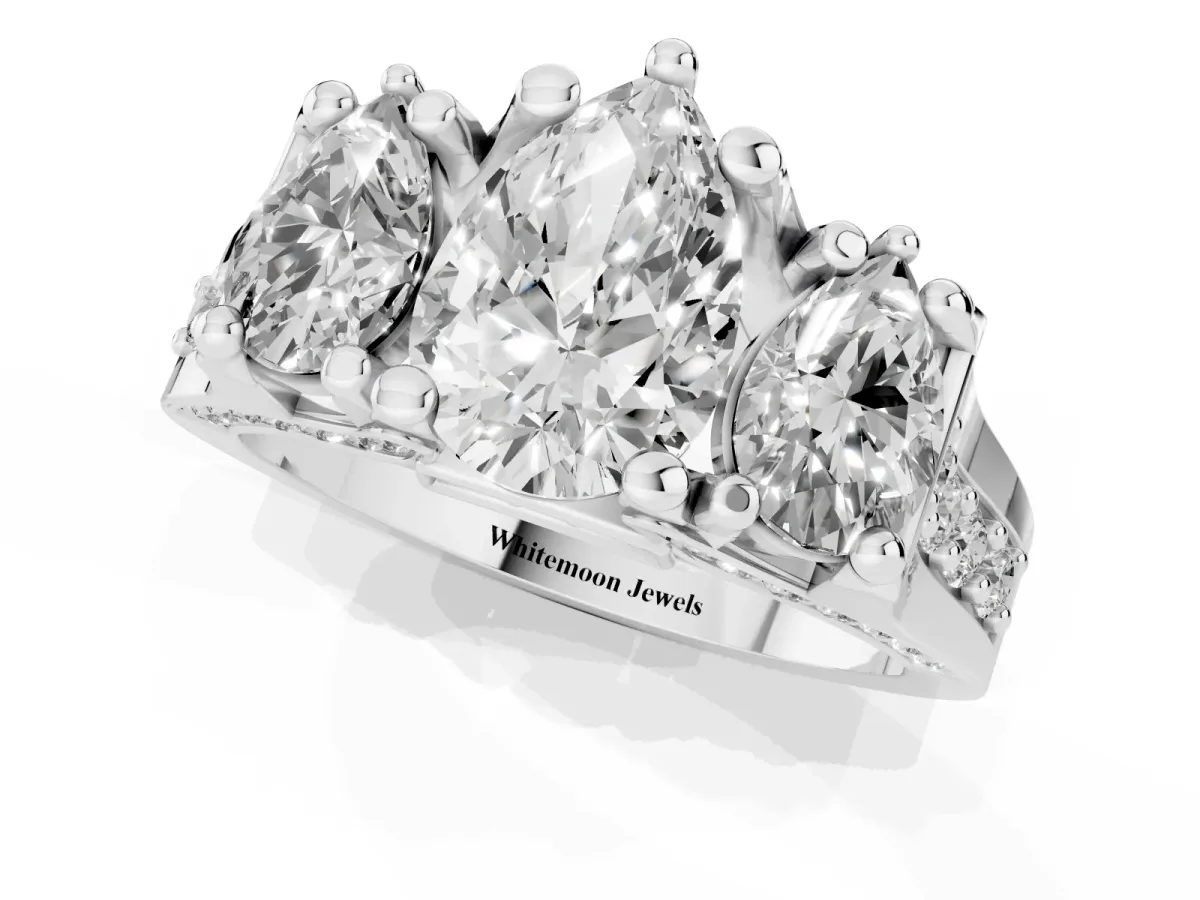 Pear Cut Diamond Three-Stone Ring with Channel Set Band and Four-Prong Setting Silver