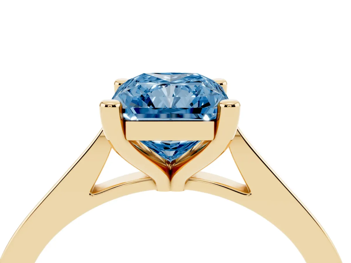 Fancy Blue Radiant Cut Solitaire Diamond Ring with Four-Prong Setting and Tapered Band Yellow gold
