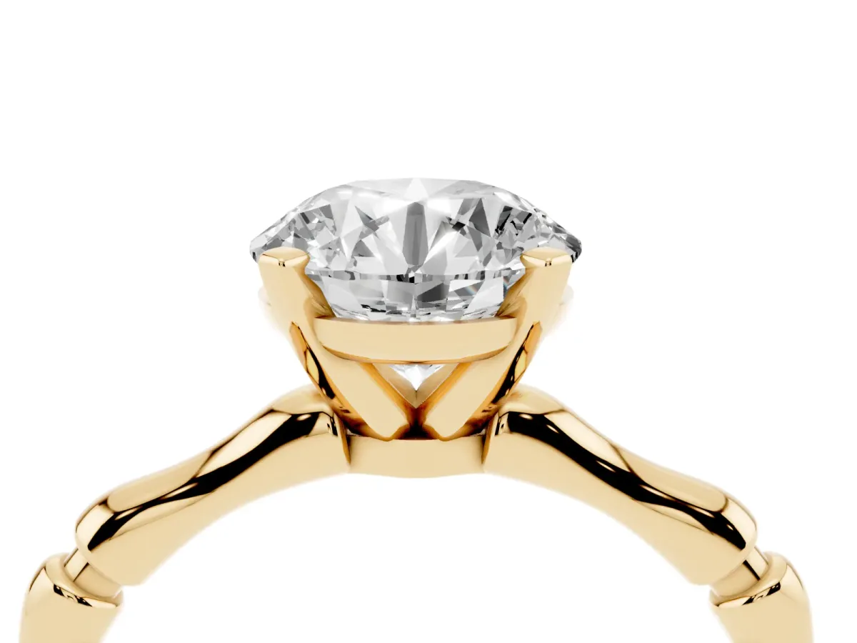 Round Cut Solitaire Diamond Ring with Bamboo Band and Four-Prong Setting Yellow gold