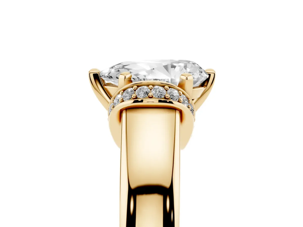 Pear Cut Solitaire Diamond Ring with Pave Band and Six-Prong Setting Yellow gold