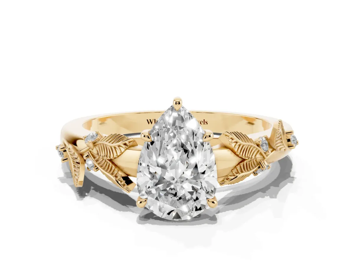 Pear Cut Diamond Solitaire Ring with Leaf Motif Band and Four-Prong Setting Yellow gold