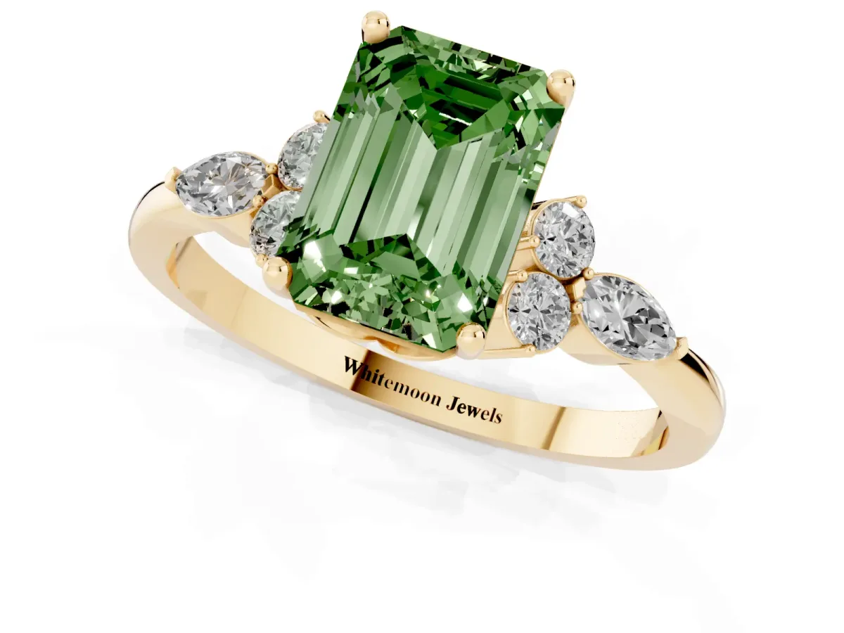 Fancy Green Emerald Cut Brilliant Diamond Solitaire Ring with Pear Side Stones and Four-Prong Setting Yellow gold