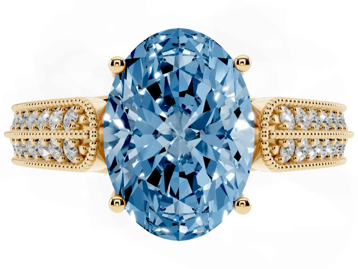 Fancy Blue Oval Cut Cut Pave Split Shank Engagement Ring with Four-Prong Setting Yellow gold