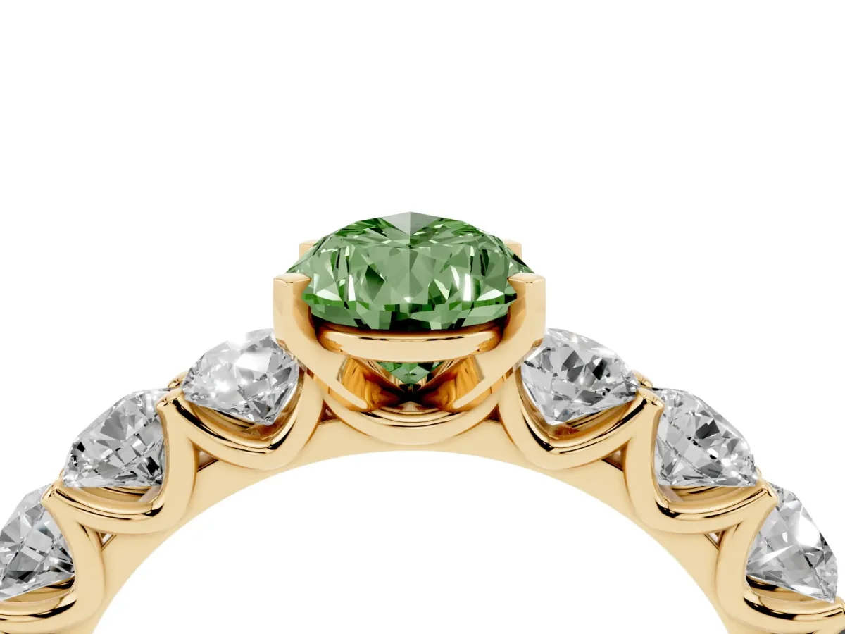 Fancy Green Pear Cut Diamond Prong Setting with Side Stones on a Pave Band Yellow gold